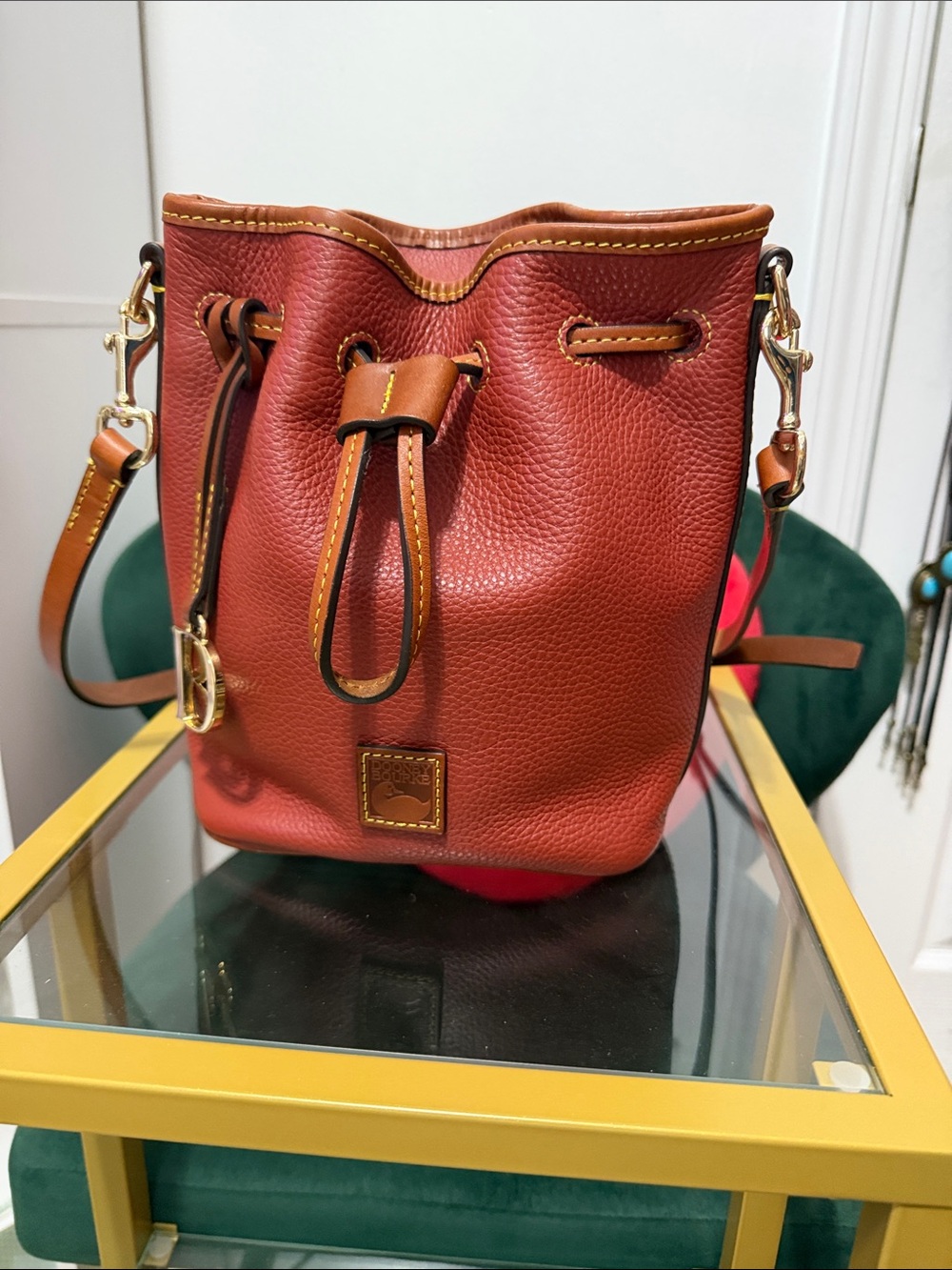 Dooney & Bourke Red-Brown Pebbled Leather Drawstring Bucket Bag